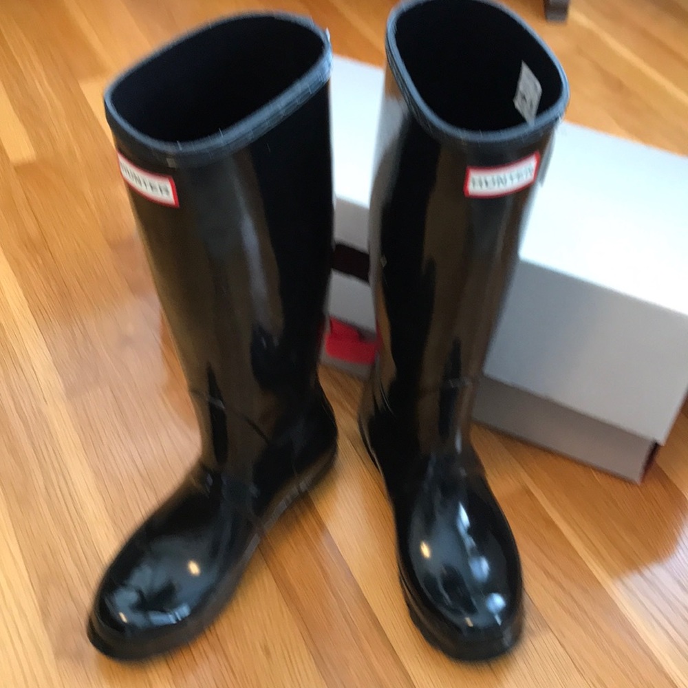 Shiny tall black Hunter rain boots